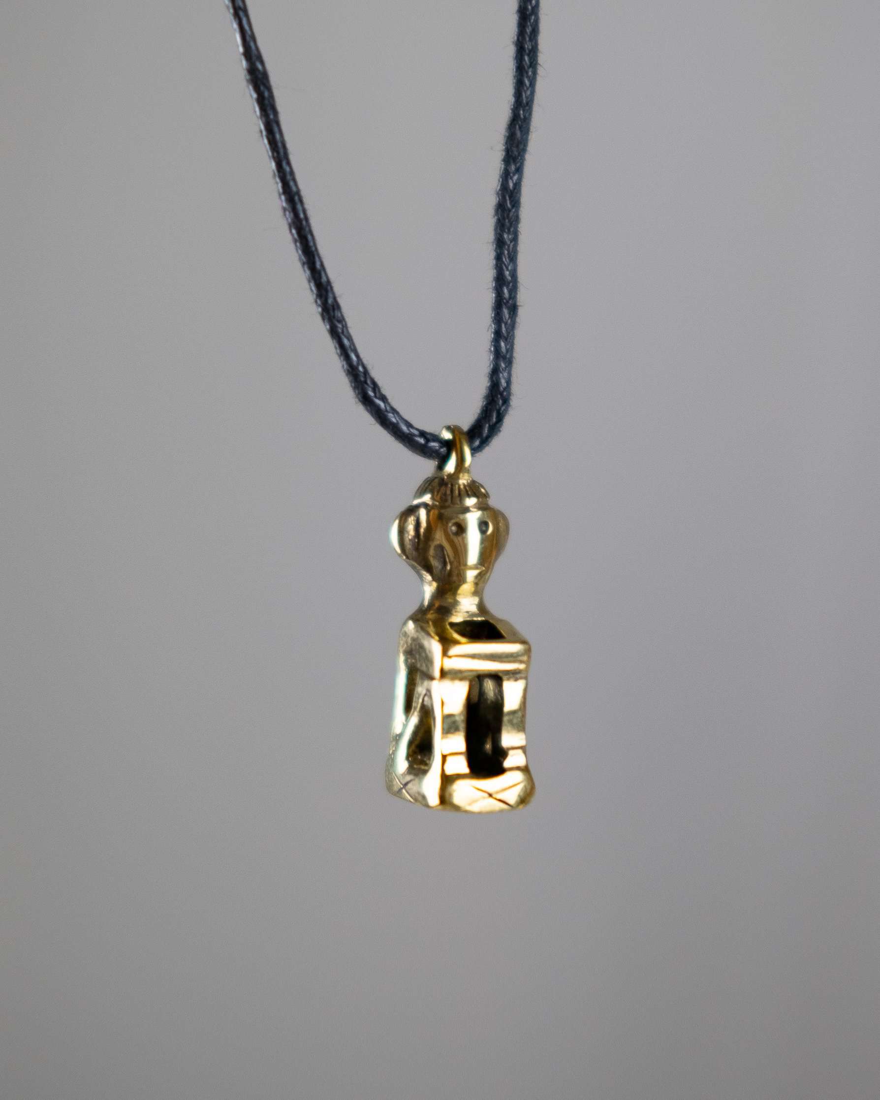 Ifugao Bulol Necklace Jewelry
A brass pendant in the shape of a traditional Ifugao bulul figure. The bulul is seated with defined facial features, representing Filipino cultural heritage and ancestral protection.