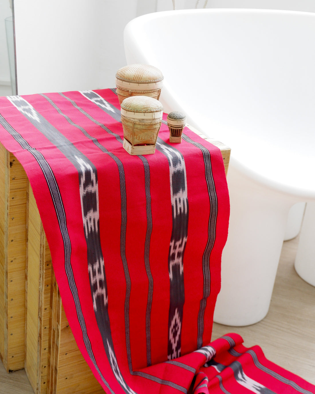Red Binanniya Ya Tinaggu Table Runner Table Runner. Handwoven Ifugao table runner in red with traditional Binanniya ya Tinaggui ikat design.