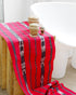 Red Binanniya Ya Tinaggu Table Runner Table Runner. Handwoven Ifugao table runner in red with traditional Binanniya ya Tinaggui ikat design.