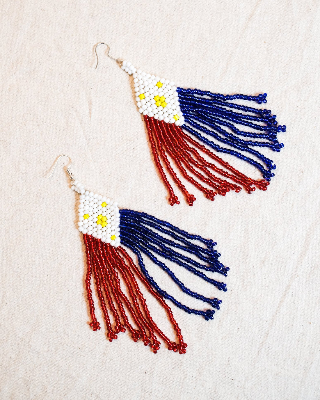 Tboli hand-beaded earrings in Philippine flag colors, with red, blue, white, and yellow beads, handmade by Filipino artisans from Lake Sebu