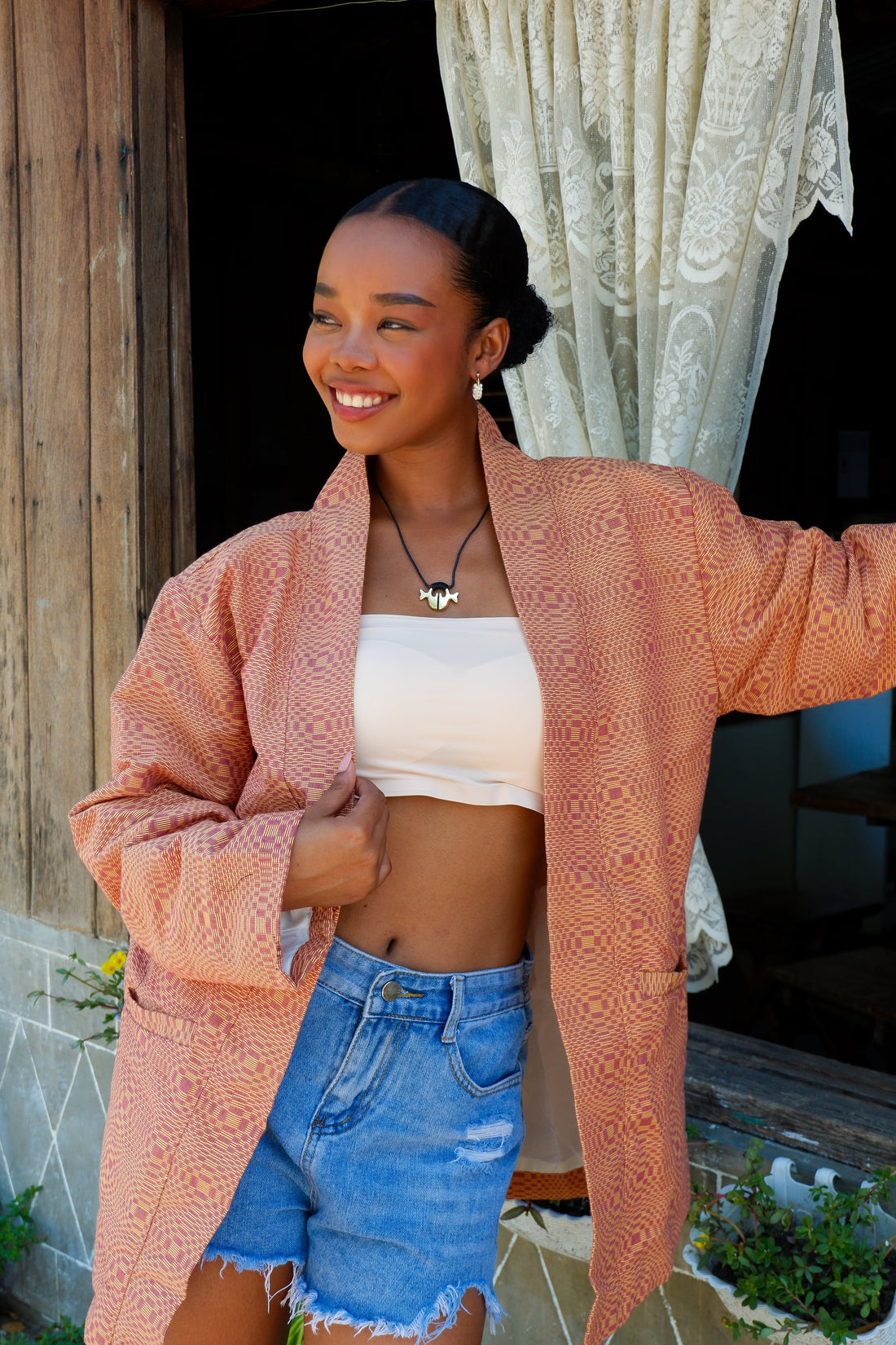 Orange Binakol jacket, a traditional Filipino handwoven textile, ideal for cultural events, workwear, or everyday looks.