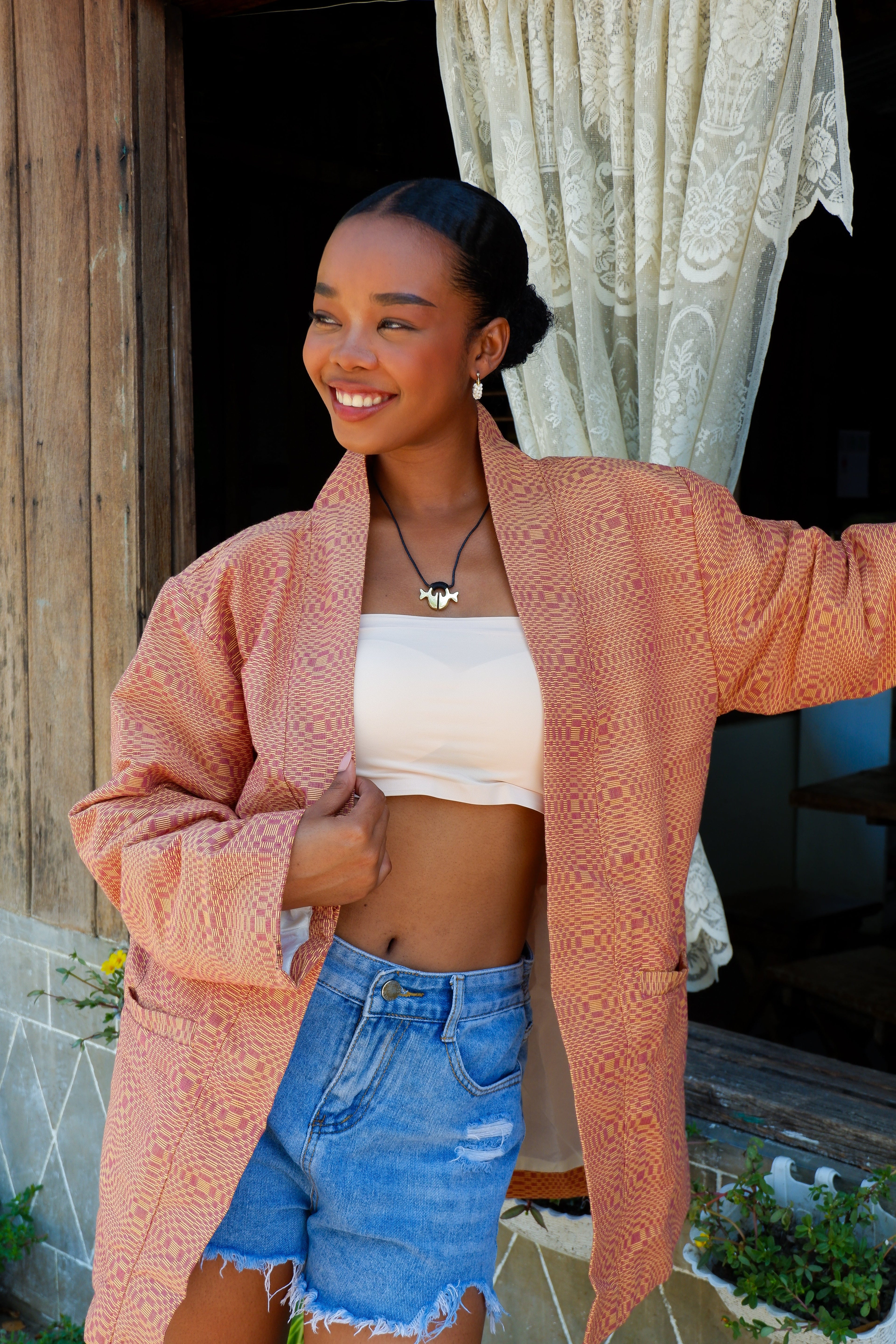 Orange Binakol jacket, a traditional Filipino handwoven textile, ideal for cultural events, workwear, or everyday looks.