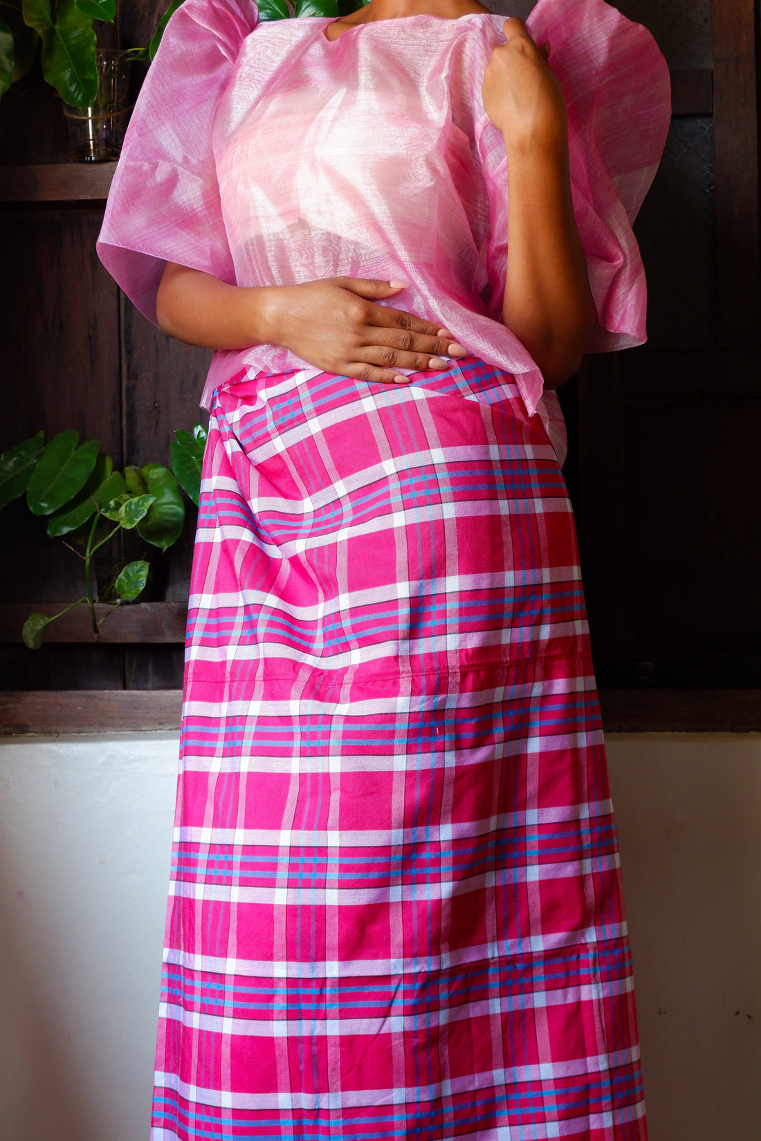 A handloomed Candy Sky checkered Patadyong from Iloilo, featuring bright pink, white, and blue plaid. It can be styled as a skirt, dress, or sarong.