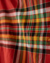A handwoven Tboli malong in standard length, featuring traditional plaid patterns in bold red, green, yellow, black, and white. The fabric showcases vibrant, intersecting stripes and fine craftsmanship.