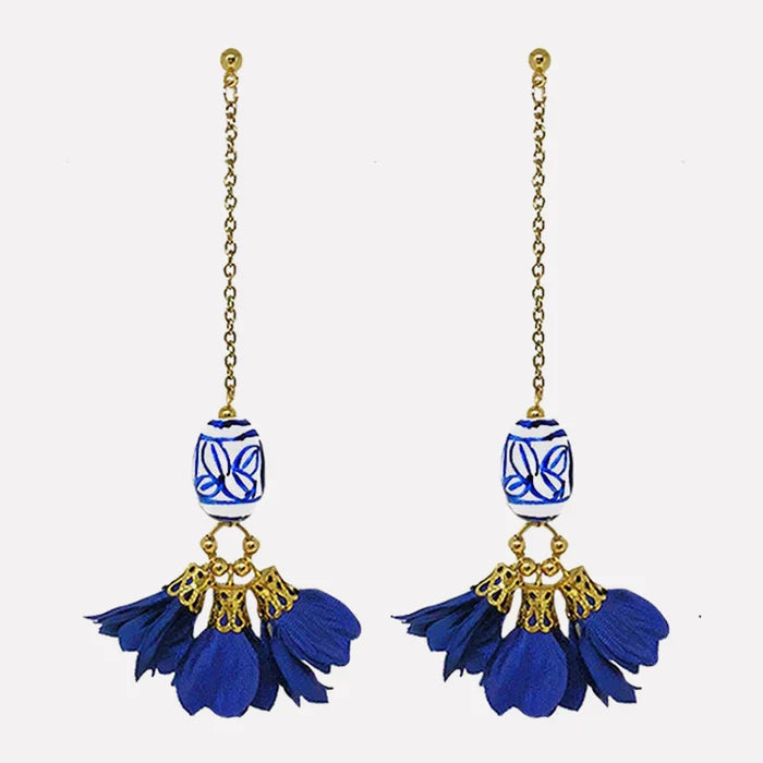 Porcelana Floral Earrings in blue and white hand-painted ceramic bead with gold-plated hardware and silk flower petals, handmade by Filipino artisans in a Chinese porcelain-inspired design.
